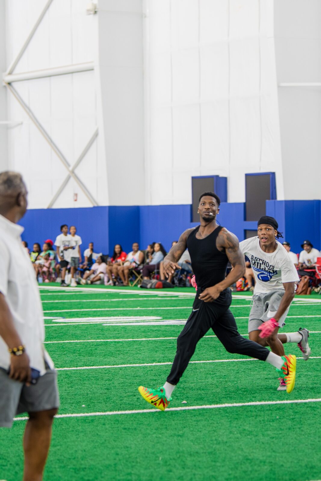 Anthony Miller II with two campers at a back-to-school event